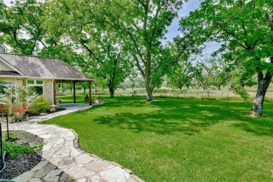 This exceptional residence in Pecan Plantation, is a stone and on Pecan Plantation Country Club in Texas - for sale on GolfHomes.com, golf home, golf lot