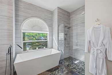 Welcome to this move-in ready 5 bedroom + bonus room, 4 bathroom on Heritage Harbor Golf and Country Club in Florida - for sale on GolfHomes.com, golf home, golf lot