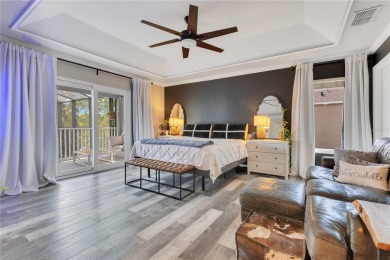 Welcome to this updated 4-bedroom, 3-bath pool home with a loft on North Shore Golf Club in Florida - for sale on GolfHomes.com, golf home, golf lot