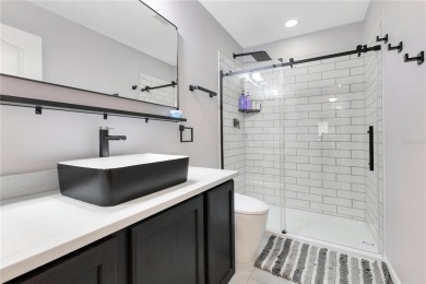 Welcome to this updated 4-bedroom, 3-bath pool home with a loft on North Shore Golf Club in Florida - for sale on GolfHomes.com, golf home, golf lot