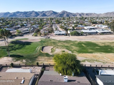 Welcome home to this charming 4-bedroom, 2-bath retreat nestled on Ahwatukee Country Club in Arizona - for sale on GolfHomes.com, golf home, golf lot