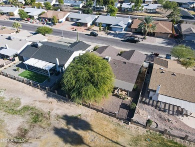 Welcome home to this charming 4-bedroom, 2-bath retreat nestled on Ahwatukee Country Club in Arizona - for sale on GolfHomes.com, golf home, golf lot