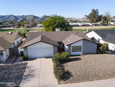 Welcome home to this charming 4-bedroom, 2-bath retreat nestled on Ahwatukee Country Club in Arizona - for sale on GolfHomes.com, golf home, golf lot