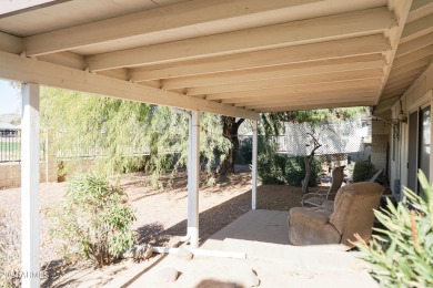 Welcome home to this charming 4-bedroom, 2-bath retreat nestled on Ahwatukee Country Club in Arizona - for sale on GolfHomes.com, golf home, golf lot