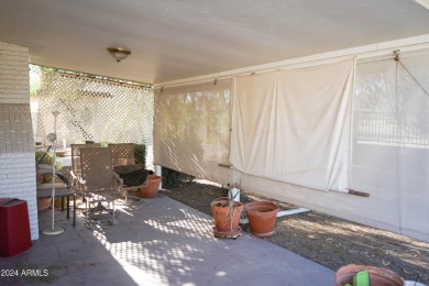 Welcome home to this charming 4-bedroom, 2-bath retreat nestled on Ahwatukee Country Club in Arizona - for sale on GolfHomes.com, golf home, golf lot