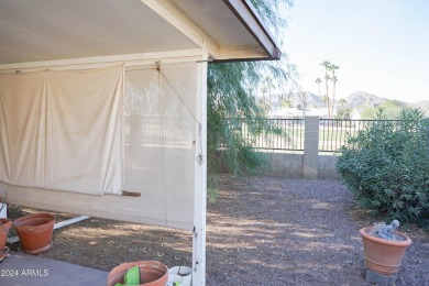 Welcome home to this charming 4-bedroom, 2-bath retreat nestled on Ahwatukee Country Club in Arizona - for sale on GolfHomes.com, golf home, golf lot