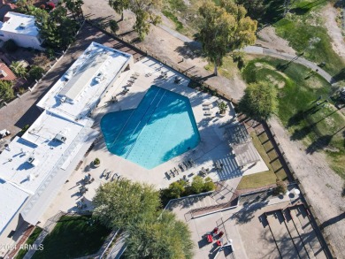 Welcome home to this charming 4-bedroom, 2-bath retreat nestled on Ahwatukee Country Club in Arizona - for sale on GolfHomes.com, golf home, golf lot