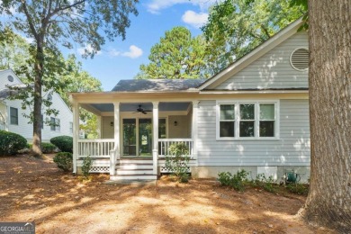 Welcome to this charming cottage nestled in the sought-after on Great Waters Course At Reynolds Plantation in Georgia - for sale on GolfHomes.com, golf home, golf lot