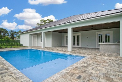 Located on PGA Golf Club's Dye Course, this luxury home has an on The Legacy Golf and Tennis Club in Florida - for sale on GolfHomes.com, golf home, golf lot