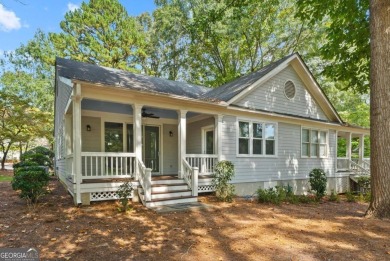 Welcome to this charming cottage nestled in the sought-after on Great Waters Course At Reynolds Plantation in Georgia - for sale on GolfHomes.com, golf home, golf lot