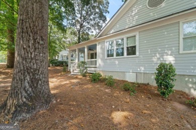 Welcome to this charming cottage nestled in the sought-after on Great Waters Course At Reynolds Plantation in Georgia - for sale on GolfHomes.com, golf home, golf lot