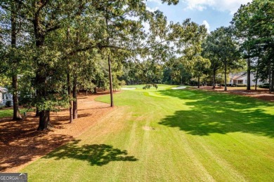 Welcome to this charming cottage nestled in the sought-after on Great Waters Course At Reynolds Plantation in Georgia - for sale on GolfHomes.com, golf home, golf lot