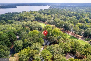 Welcome to this charming cottage nestled in the sought-after on Great Waters Course At Reynolds Plantation in Georgia - for sale on GolfHomes.com, golf home, golf lot