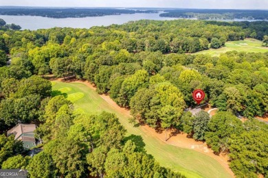 Welcome to this charming cottage nestled in the sought-after on Great Waters Course At Reynolds Plantation in Georgia - for sale on GolfHomes.com, golf home, golf lot