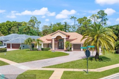 Desirable Grand Cayman model with Screened-in pool with spa on Binks Forest Golf Club in Florida - for sale on GolfHomes.com, golf home, golf lot