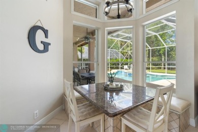 Desirable Grand Cayman model with Screened-in pool with spa on Binks Forest Golf Club in Florida - for sale on GolfHomes.com, golf home, golf lot