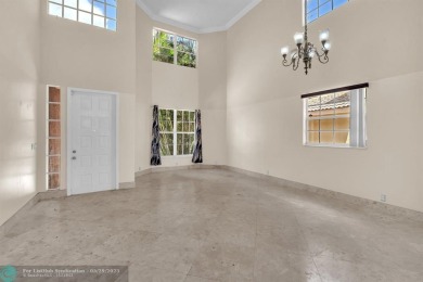 Discover this beautiful 2-story residence at the gated community on Palm-Aire Country Club and Resort - The Oaks in Florida - for sale on GolfHomes.com, golf home, golf lot