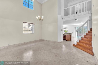 Discover this beautiful 2-story residence at the gated community on Palm-Aire Country Club and Resort - The Oaks in Florida - for sale on GolfHomes.com, golf home, golf lot