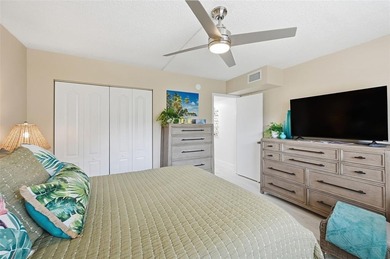 Beautifully updated second-floor condo featuring a tropical on Wynmoor Golf Course in Florida - for sale on GolfHomes.com, golf home, golf lot