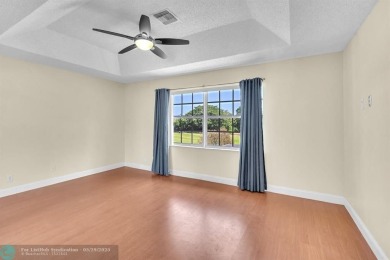 Discover this beautiful 2-story residence at the gated community on Palm-Aire Country Club and Resort - The Oaks in Florida - for sale on GolfHomes.com, golf home, golf lot