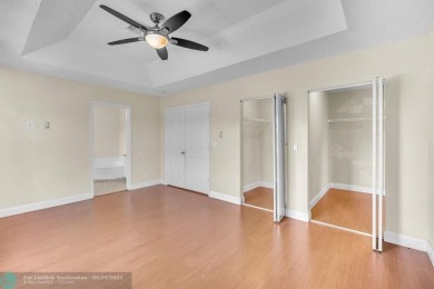 Discover this beautiful 2-story residence at the gated community on Palm-Aire Country Club and Resort - The Oaks in Florida - for sale on GolfHomes.com, golf home, golf lot