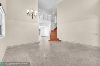 Discover this beautiful 2-story residence at the gated community on Palm-Aire Country Club and Resort - The Oaks in Florida - for sale on GolfHomes.com, golf home, golf lot