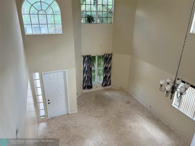 Discover this beautiful 2-story residence at the gated community on Palm-Aire Country Club and Resort - The Oaks in Florida - for sale on GolfHomes.com, golf home, golf lot