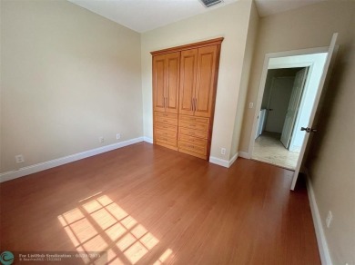 Discover this beautiful 2-story residence at the gated community on Palm-Aire Country Club and Resort - The Oaks in Florida - for sale on GolfHomes.com, golf home, golf lot