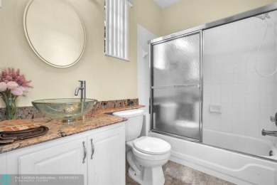 Discover this beautiful 2-story residence at the gated community on Palm-Aire Country Club and Resort - The Oaks in Florida - for sale on GolfHomes.com, golf home, golf lot