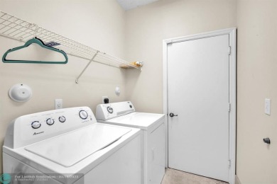 Discover this beautiful 2-story residence at the gated community on Palm-Aire Country Club and Resort - The Oaks in Florida - for sale on GolfHomes.com, golf home, golf lot