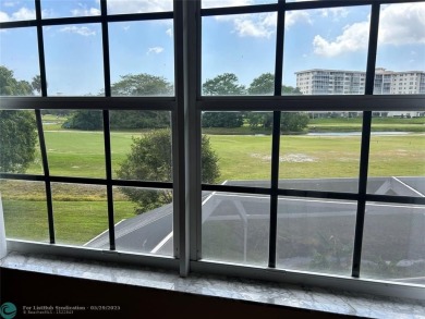 Discover this beautiful 2-story residence at the gated community on Palm-Aire Country Club and Resort - The Oaks in Florida - for sale on GolfHomes.com, golf home, golf lot