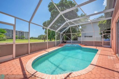 Discover this beautiful 2-story residence at the gated community on Palm-Aire Country Club and Resort - The Oaks in Florida - for sale on GolfHomes.com, golf home, golf lot