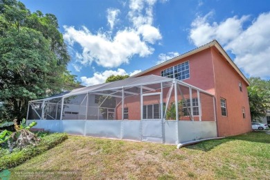Discover this beautiful 2-story residence at the gated community on Palm-Aire Country Club and Resort - The Oaks in Florida - for sale on GolfHomes.com, golf home, golf lot