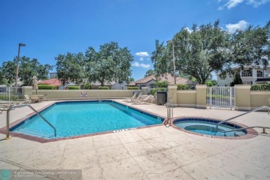 Discover this beautiful 2-story residence at the gated community on Palm-Aire Country Club and Resort - The Oaks in Florida - for sale on GolfHomes.com, golf home, golf lot