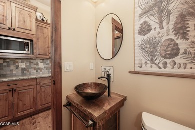 Set on three private acres in Pole Creek Timbers, this on Pole Creek Golf Club in Colorado - for sale on GolfHomes.com, golf home, golf lot