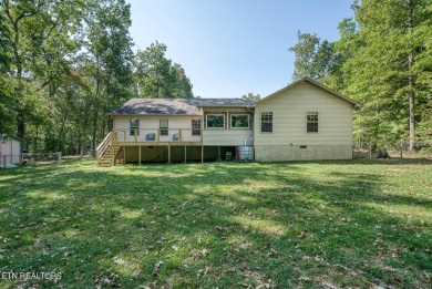 Step into this beautifully maintained 3-bedroom, 2-bathroom home on Lake Tansi Village Country Club in Tennessee - for sale on GolfHomes.com, golf home, golf lot