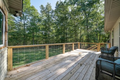 Step into this beautifully maintained 3-bedroom, 2-bathroom home on Lake Tansi Village Country Club in Tennessee - for sale on GolfHomes.com, golf home, golf lot