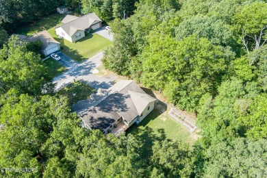 Step into this beautifully maintained 3-bedroom, 2-bathroom home on Lake Tansi Village Country Club in Tennessee - for sale on GolfHomes.com, golf home, golf lot