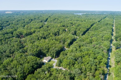 Step into this beautifully maintained 3-bedroom, 2-bathroom home on Lake Tansi Village Country Club in Tennessee - for sale on GolfHomes.com, golf home, golf lot