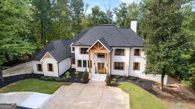Welcome to this breathtaking four-sided brick estate, perfectly on Whitewater Creek in Georgia - for sale on GolfHomes.com, golf home, golf lot