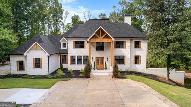 Welcome to this breathtaking four-sided brick estate, perfectly on Whitewater Creek in Georgia - for sale on GolfHomes.com, golf home, golf lot