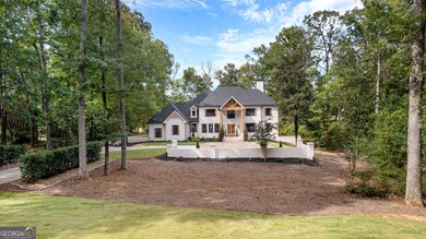 Welcome to this breathtaking four-sided brick estate, perfectly on Whitewater Creek in Georgia - for sale on GolfHomes.com, golf home, golf lot