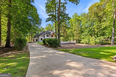Welcome to this breathtaking four-sided brick estate, perfectly on Whitewater Creek in Georgia - for sale on GolfHomes.com, golf home, golf lot