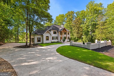 Welcome to this breathtaking four-sided brick estate, perfectly on Whitewater Creek in Georgia - for sale on GolfHomes.com, golf home, golf lot