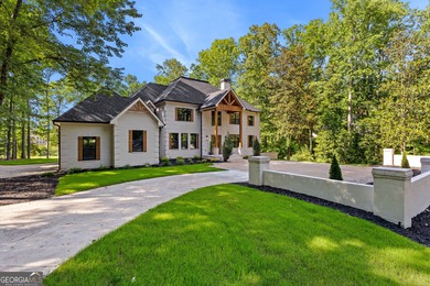 Welcome to this breathtaking four-sided brick estate, perfectly on Whitewater Creek in Georgia - for sale on GolfHomes.com, golf home, golf lot