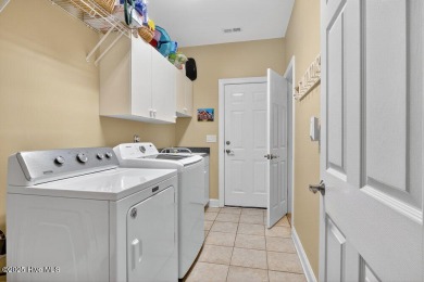 This custom-built brick home offers 2,970 sq.ft. of living space on Magnolia Greens Golf Plantation in North Carolina - for sale on GolfHomes.com, golf home, golf lot