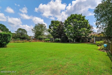 This custom-built brick home offers 2,970 sq.ft. of living space on Magnolia Greens Golf Plantation in North Carolina - for sale on GolfHomes.com, golf home, golf lot