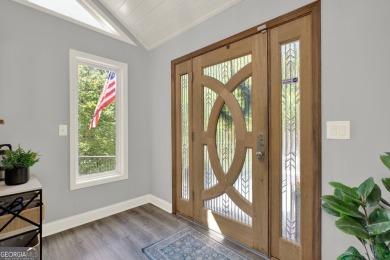 Welcome to 117 Lakeview Circle-an exceptional lakefront retreat on The Highlands Course at Lake Arrowhead in Georgia - for sale on GolfHomes.com, golf home, golf lot