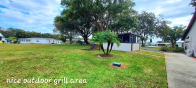 55+/1989/2 BD/2 BA/800 SQ FT/NEW FLOORING/LARGE SCREENED LANAI on Zephyrhills Municipal Golf Course in Florida - for sale on GolfHomes.com, golf home, golf lot