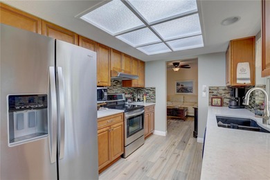 Welcome to elevated Florida living at its finest in this on Highland Lakes Executive Golf Course in Florida - for sale on GolfHomes.com, golf home, golf lot